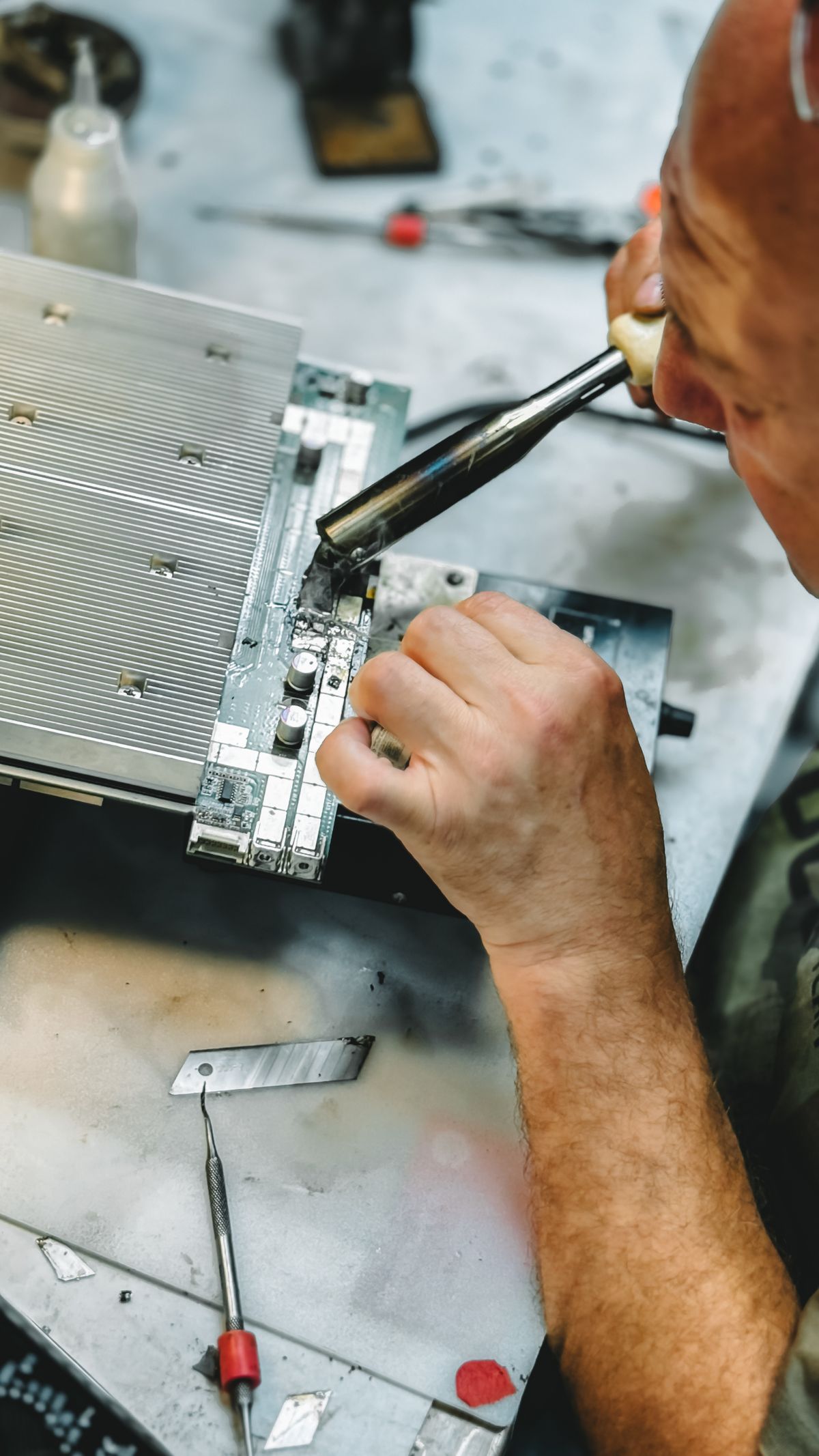 Technician performing hands-on hardware repair